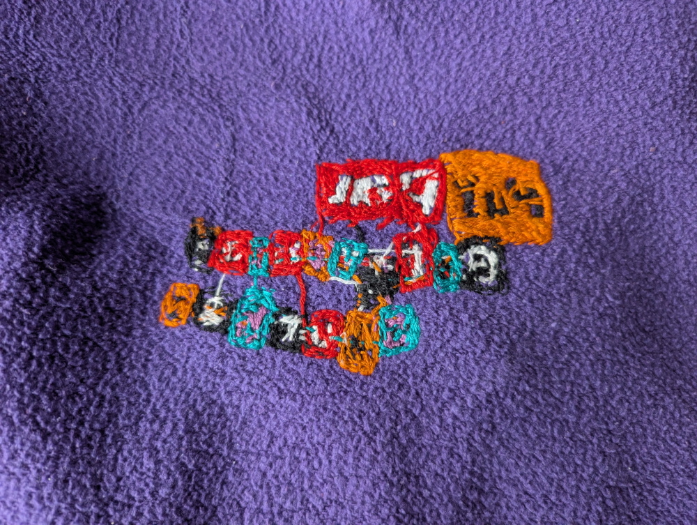 Vidinė išsiuvinėtos emblemos pusė.